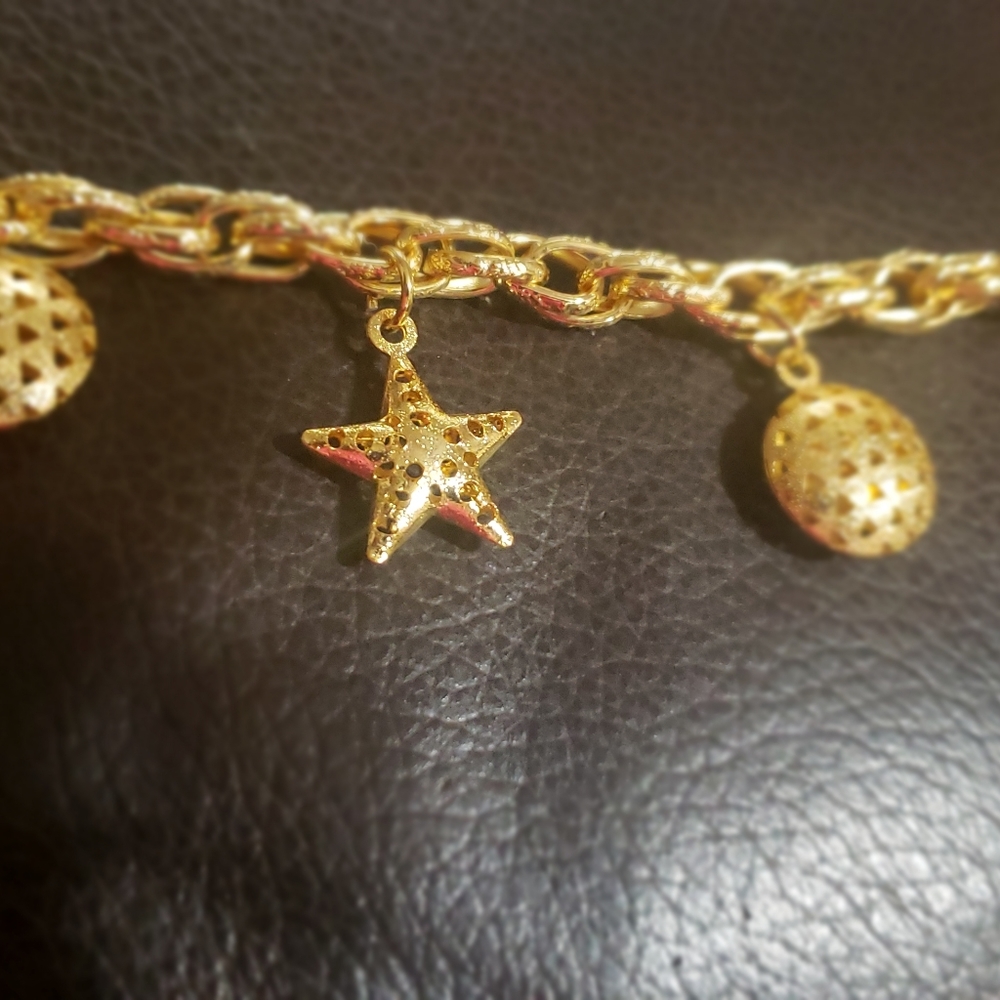 9" Gold platelet stainless steel charm Bracelet.